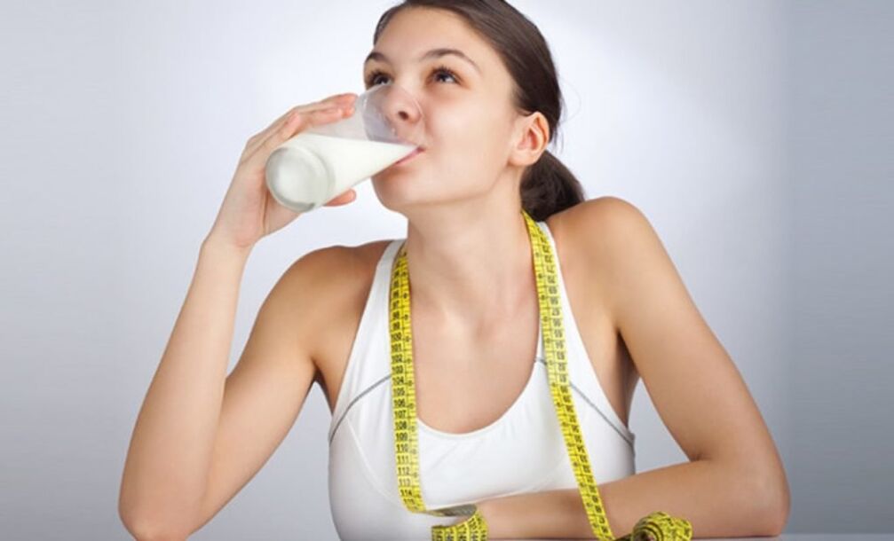 the girl drinks kefir for weight loss