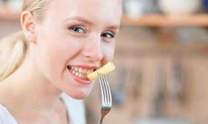 Girl eating pasta